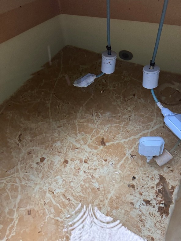 Tank interior before disinfection — heavy contamination and deposits